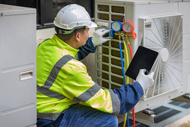 Professional Heat Pump Repair technician working in Clearfield, UT
